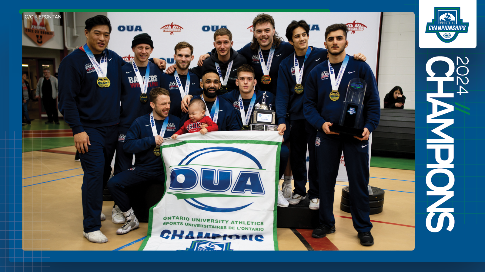 Predominantly blue graphic covered mostly by 2024 OUA Men's Wrestling Championship banner photo, with the corresponding championship logo and white text reading '2024 Champions' on the right side
