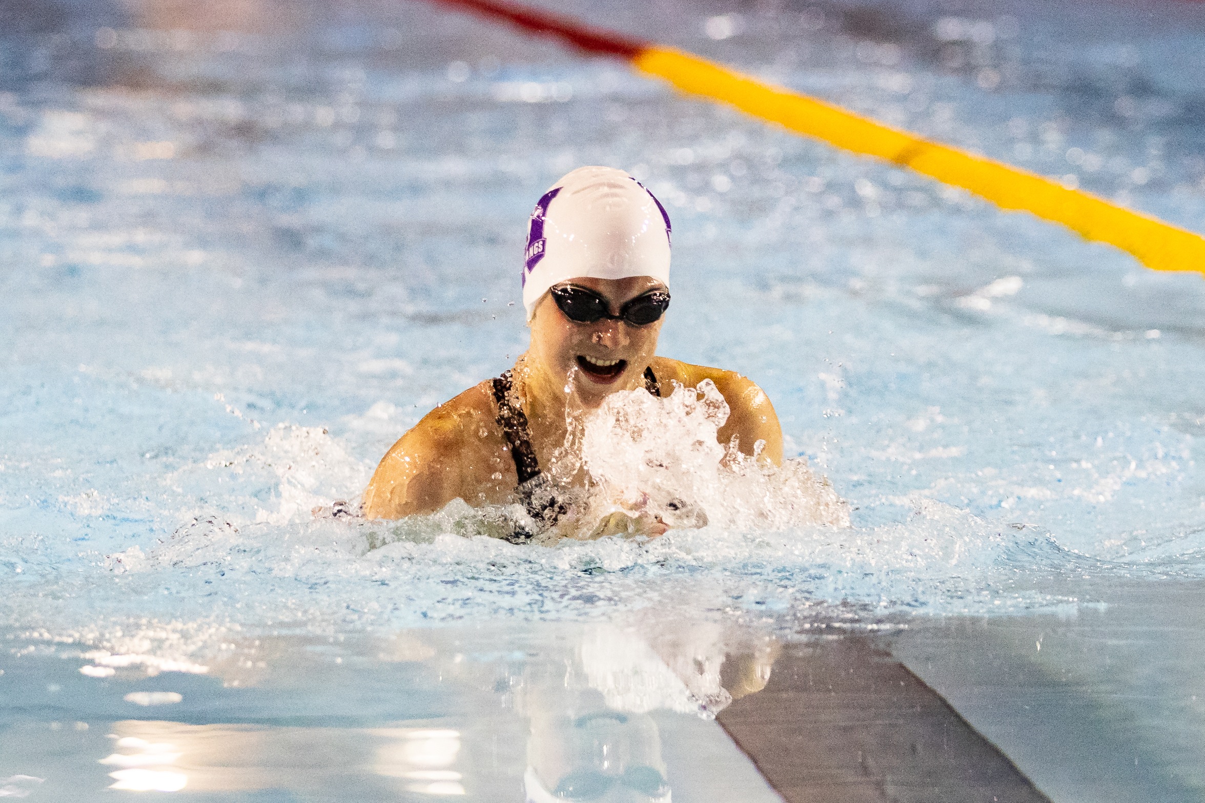 An action photo of Western Mustangs swimmer Shona Branton swimming with her head out of the pool.
