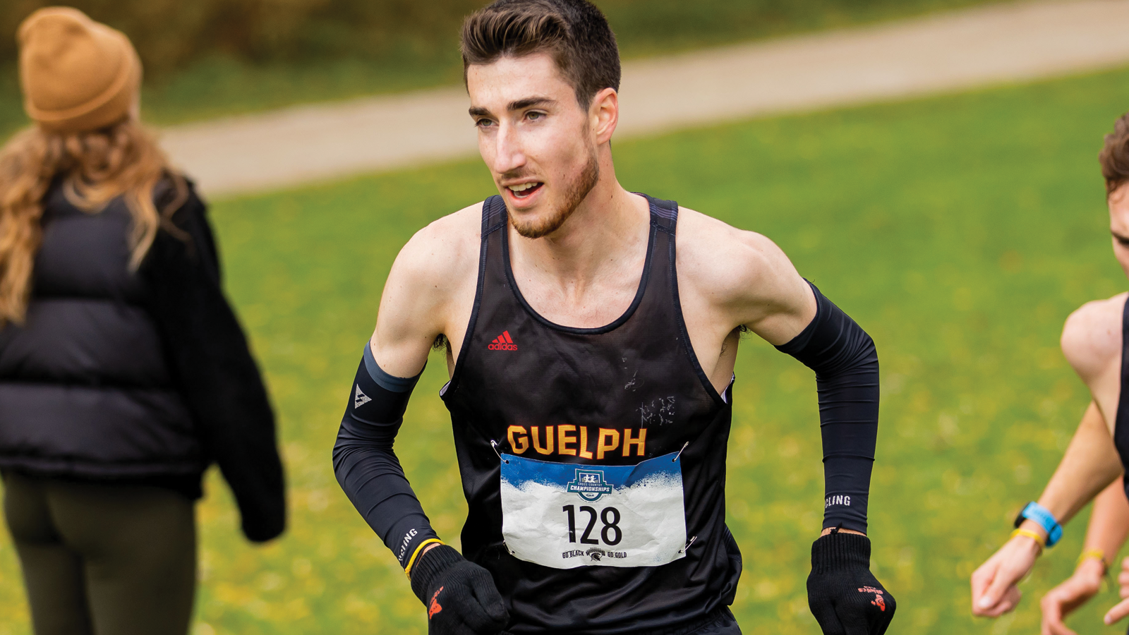 Guelph men's cross country runner Nicholas Bannon running on course during the OUA Championships