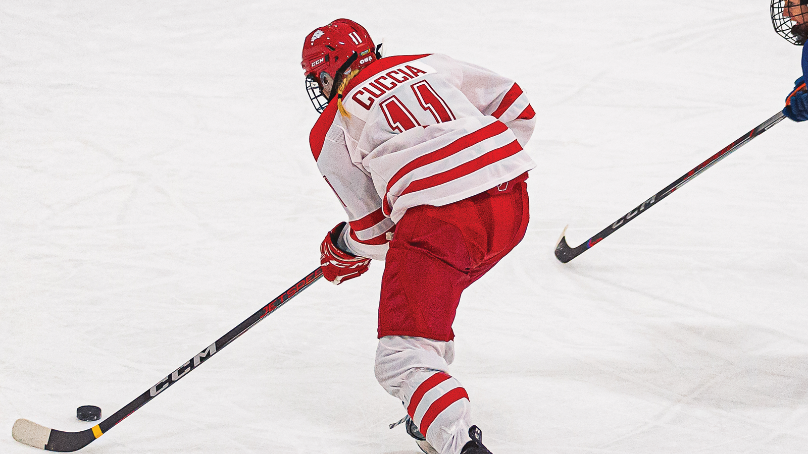 York women's hockey player skating with the puck