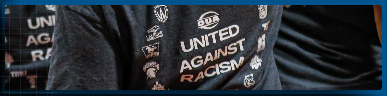 Graphic showcasing team huddle with team members wearing OUA United Against Racism t-shirts