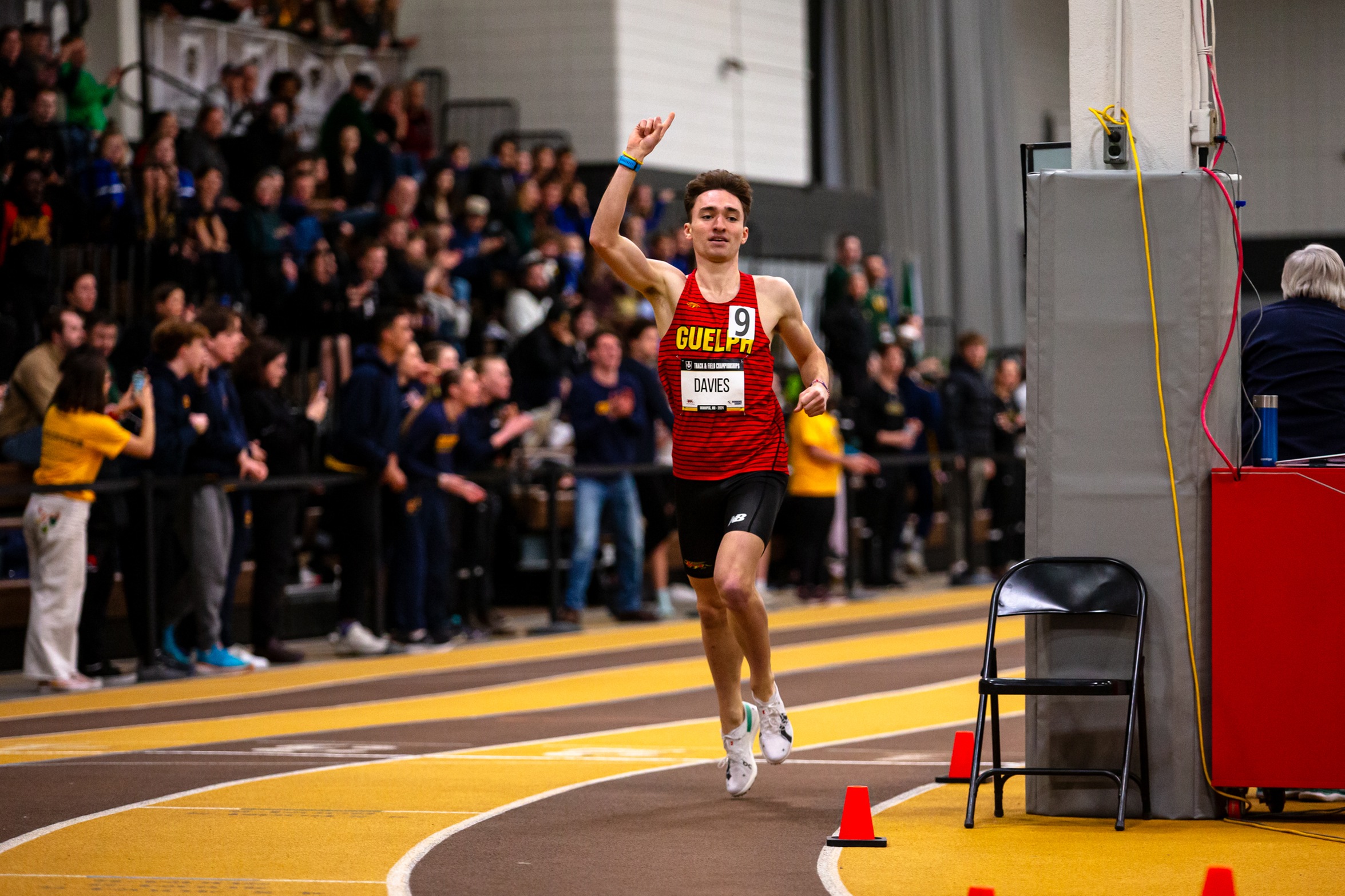 An action photo of Guelph Gryphons Track athlete Max Davies running on the track.
