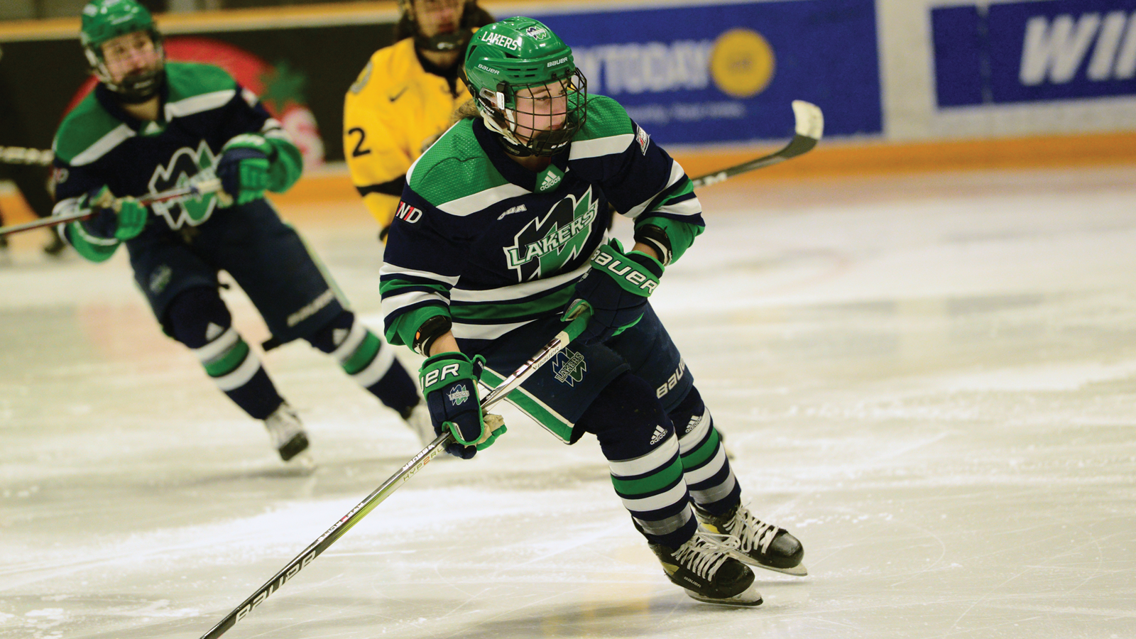 Nipissing women's hockey player Abby Lunney skating on the ice during a game